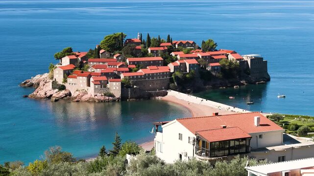 View of Sveti Stefan, a small island with Mediterranean architecture on the coast of Montenegro