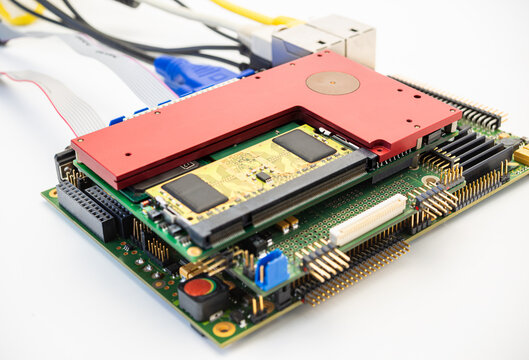 Computer circuit board with chips and connectors on a white background