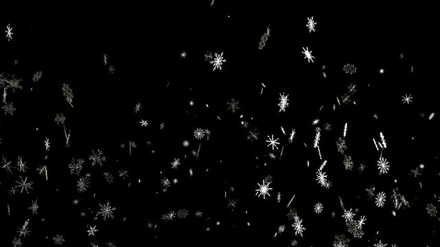 Sparkling frozen particles gently descend creating a beautiful cold weather scene.