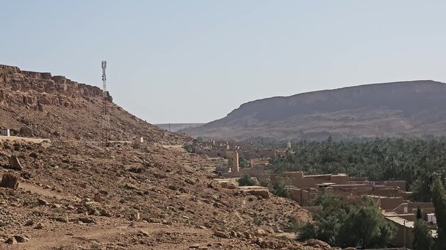 Mudbrick village and palmery beneath a plateau in the Ziz Canyon, Draa-Tafilalet, Morocco