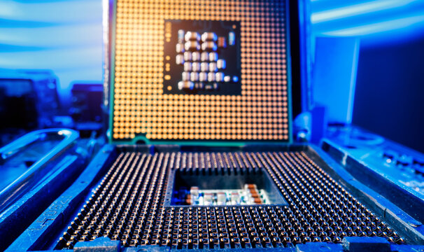 Macro Probe view of cpu microprocessor and motherboard pins with blue accent lighting for technology wallpaper AI innovation