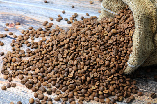 coffee beans spilling out of the burlap sack