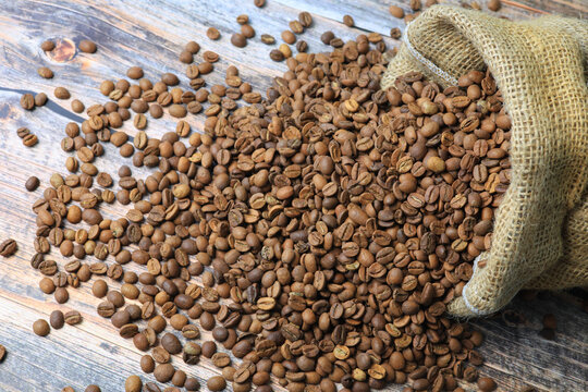 coffee beans spilling out of the burlap sack	
