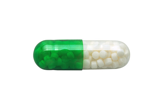 Close-up of a green and white capsule filled with small pellets, isolated n transparent  background, perfect for pharmacy, healthcare, or medical themes.