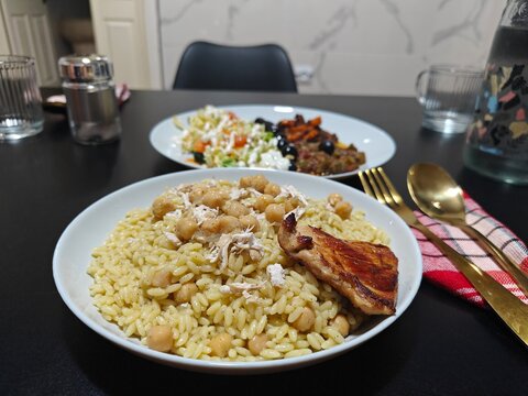 Traditional Algerian Tlitli (Orzo Pasta) with Chicken and Chickpeas in Annaba