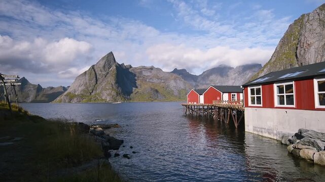 Rorbuer on wooden stilts above clear water, Hamnoy, Lofoten, Norway
