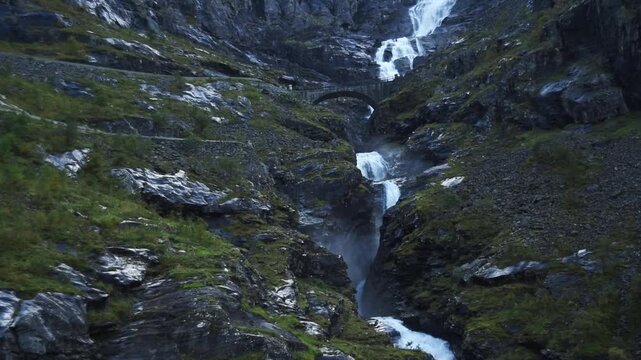 Stone arch bridge spanning the Stigfossen waterfall, Trollstigen, Route 63, More og Romsdal, Norway
