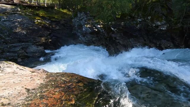 White water and mossy ledges below the timber walkway, Gudbrandsjuvet, Valldal, More og Romsdal, Norway