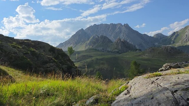 Bric Cassin ridge rising above green alpine pastures seen from Colle del Preit, Preit, Canosio, Valle Maira, Cuneo, Piedmont