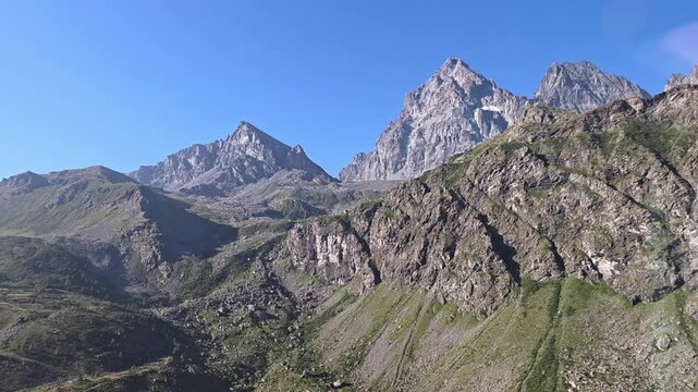 Rugged flank of Monviso towering above the upper valley near the Po source, Pian del Re, Crissolo, Cuneo, Piedmont