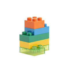 Naklejka premium Stack of colorful plastic building blocks including orange, blue, green, and yellow bricks on a white surface isolated on a transparent background