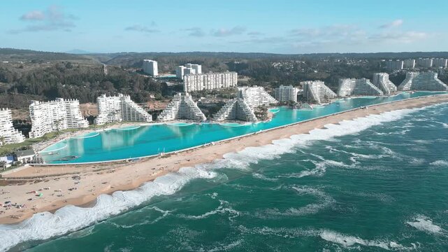 Aerial view of the San Alfonso del Mar resort featuring its massive turquoise swimming pool along the coastline in Algarrobo, Valparaiso, Chile.