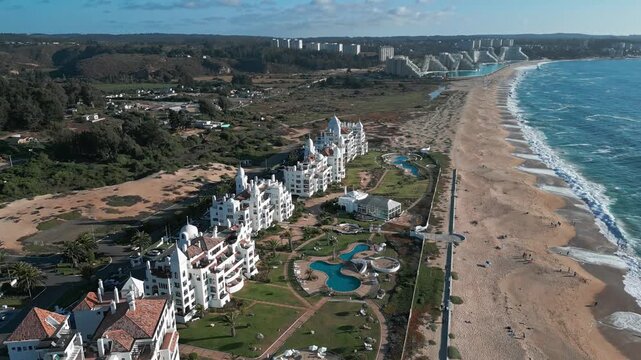 Aerial view of the San Alfonso del Mar resort featuring white buildings, swimming pools, and the coastline in Algarrobo, Valparaiso, Chile.