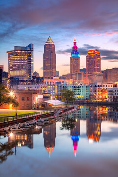 Cleveland, Ohio, USA. Cityscape image of Cleveland, Ohio with reflection of the city skyline in the water at beautiful sunrise.