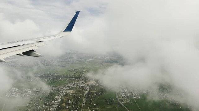 Vietnam airplane window view at airport take of landing