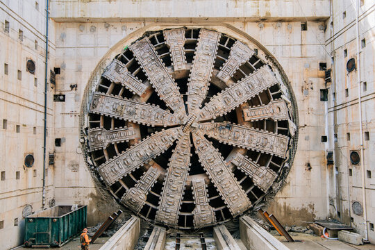 A tunnel boring machine operates at a construction site