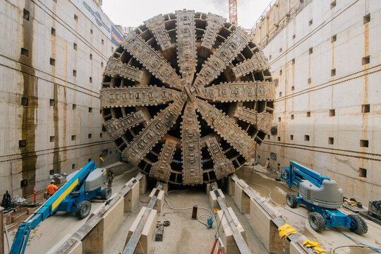 A tunnel boring machine at a concrete-lined construction site
