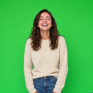 Young Woman Portrait laughing at Camera on Green Screen