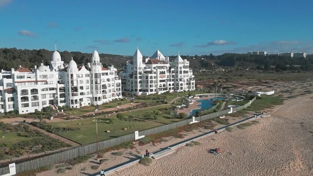 Aerial view of San Alfonso del Mar resort with its iconic white architecture, swimming pools, and landscaped gardens along the coastline in Algarrobo, Valparaiso, Chile.