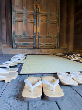 Traditional Japanese geta and zori footwear at temple entrance