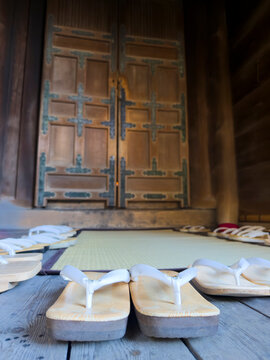 Traditional Japanese geta and zori sandals outside temple