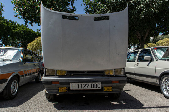 Tavernes Blanques, Spain - June 14, 2026.Silver Renault TXE shows open bonnet with quad headlights and yellow fog lights on a street in Spain