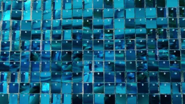 Abstract background in Germany with hanging mirror squares, blue reflective mosaic, shifting highlights, geometric texture and wind-driven motion