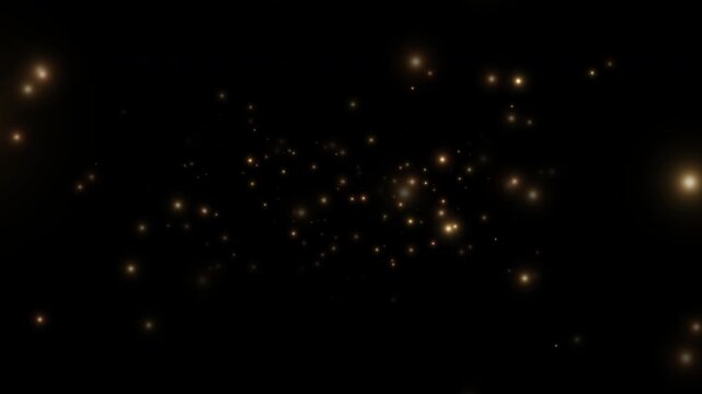 Smoothly flying glowing particles on a black background. Golden particles, shimmering light particles, magical golden dust. 4K video.