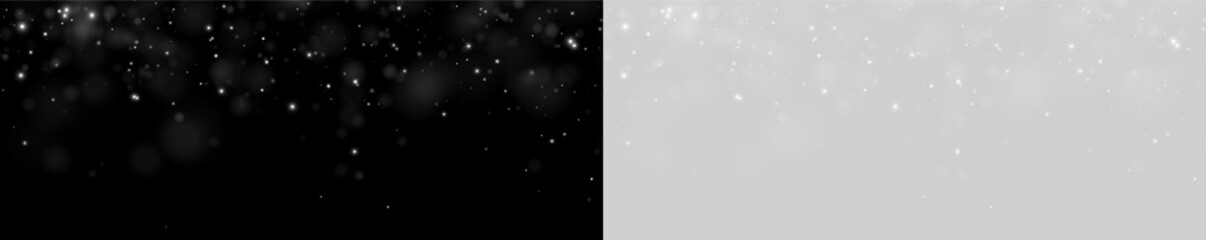 Tiny glowing particles drift softly against a dark backdrop. White light spots vary in intensity and size, scattered sparsely across the frame. This image is ideal for themes of magic. © rocoverystock