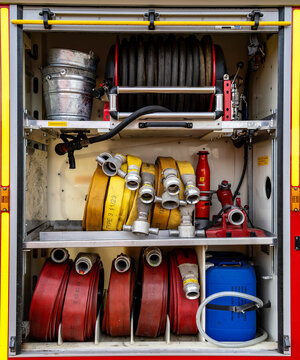 Fire engine equipment locker with hoses and rescue gear