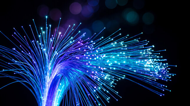 Glowing fiber optic strands with blue and purple lights on a dark background, symbolizing connectivity, digital network, and modern technology