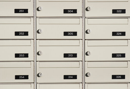 rows of postal boxes with numbers