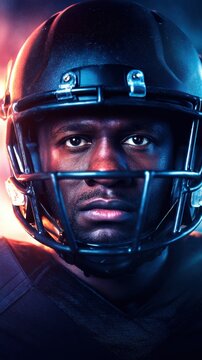 Intense portrait of an athlete in black helmet, bathed in dramatic blue and orange lighting