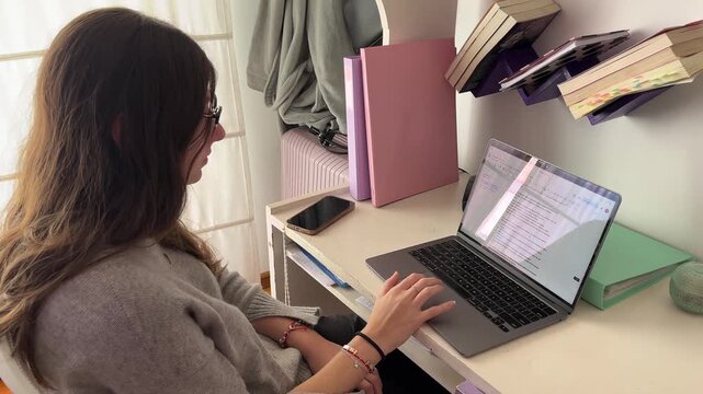 Digital native girl who uses technology to work or study remotely, showing stress and tiredness on the workday