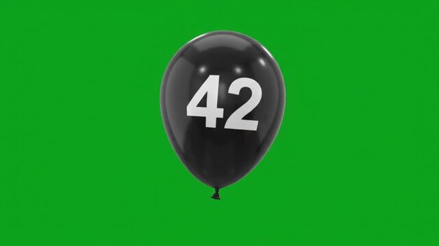 Black balloon with number 42 floating on green screen