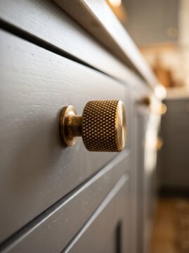 Luxury Solid Brass Knurled Cabinet Knob Mounted on Smooth Matte Soft Grey Painted Custom Millwork
