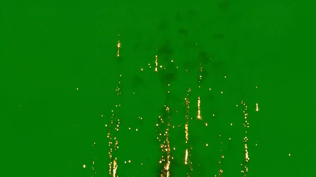 Golden fireworks explosion on green screen, isolated sparkle overlay for celebration and party motion