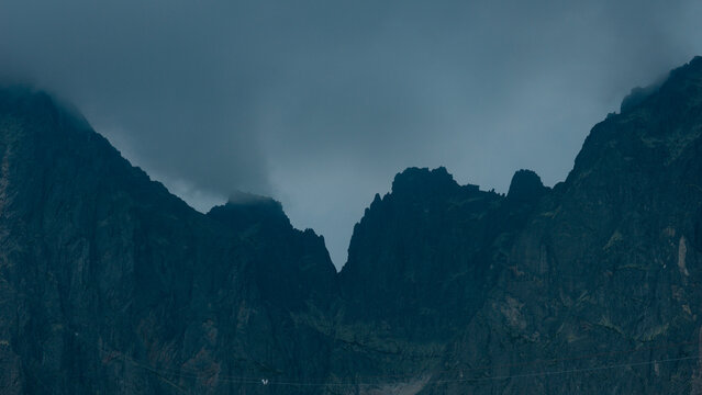 carpathians lomnicky stit peak high tatras mountains stormy dark sky cloudy weather atmosphere dramatic landscape nature exploration tourism concept of weather, travel, adventure, climate, environment