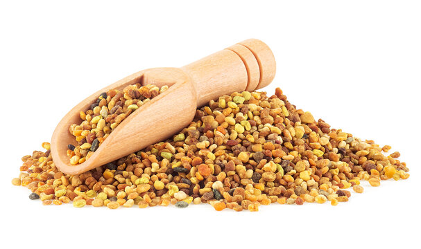 Honey bee pollen pile in wooden spoon isolated on a white background. Bee bread, Ambrosia.