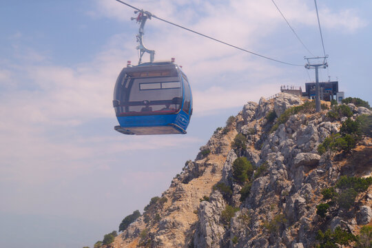 View of blue funicular or ropeway and public transport to top of mountain, Babadag, T&uuml;rkiye