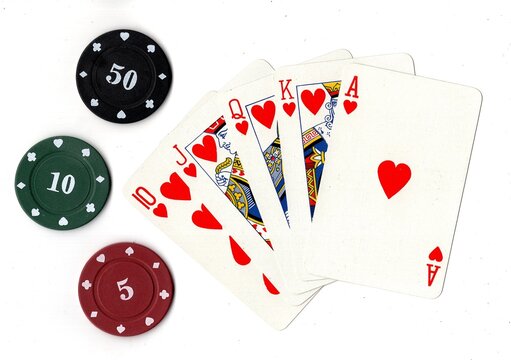 Vintage playing cards and poker chips on a black background.