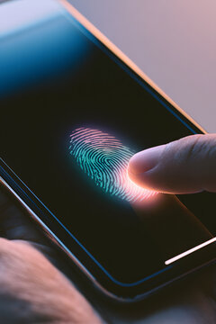 User is verifying secure digital identity access through a biometric fingerprint scan for authentication