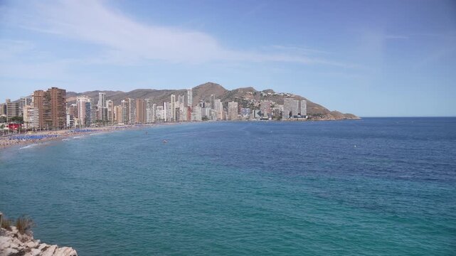 View of sea and hotels and high rise buildings lining coastline of Playa Levante sandy beach, Benidorm, Alicante Province, Costa Blanca, Spain