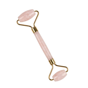 Dual ended rose quartz facial roller with gold metal hardware for skincare massage isolated on a transparent background