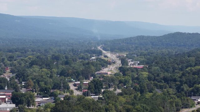 Aerial of small town Dunlap in east Tennessee with heavily forested hills and valley