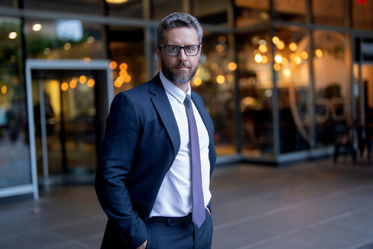 Business boss portrait man. Successful business. Success of entrepreneur. Office manager at business break. Successful businessman at the entrance to office. Professional business man wear suit