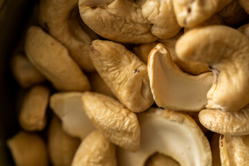 Fototapeta premium Cashew Nuts Close Up Showing Natural Texture and Shape, Healthy Food Background