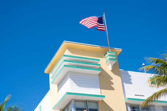 Art Deco building with American flag. Independence day of America. USA flag. Modern building with American flag. Independence day with American flag. Ocean drive. Miami South Beach in Ocean Drive