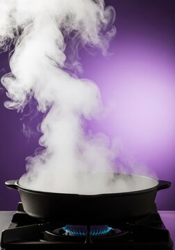 Hot steam rises from a heavy black cast iron pan heating on a burner, set against a smooth purple background for a modern kitchen aesthetic, smoke, black, purple