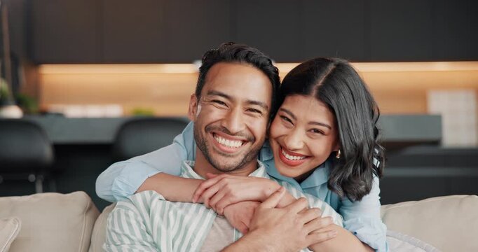 Face, couple and hug with laugh on sofa for bonding together, relationship joke and support. Love, happy people and embrace in home for affection, healthy marriage and funny conversation on weekend